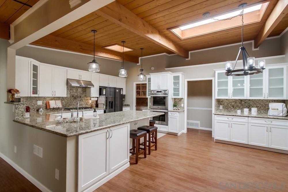 Kitchen with skylight and granite island